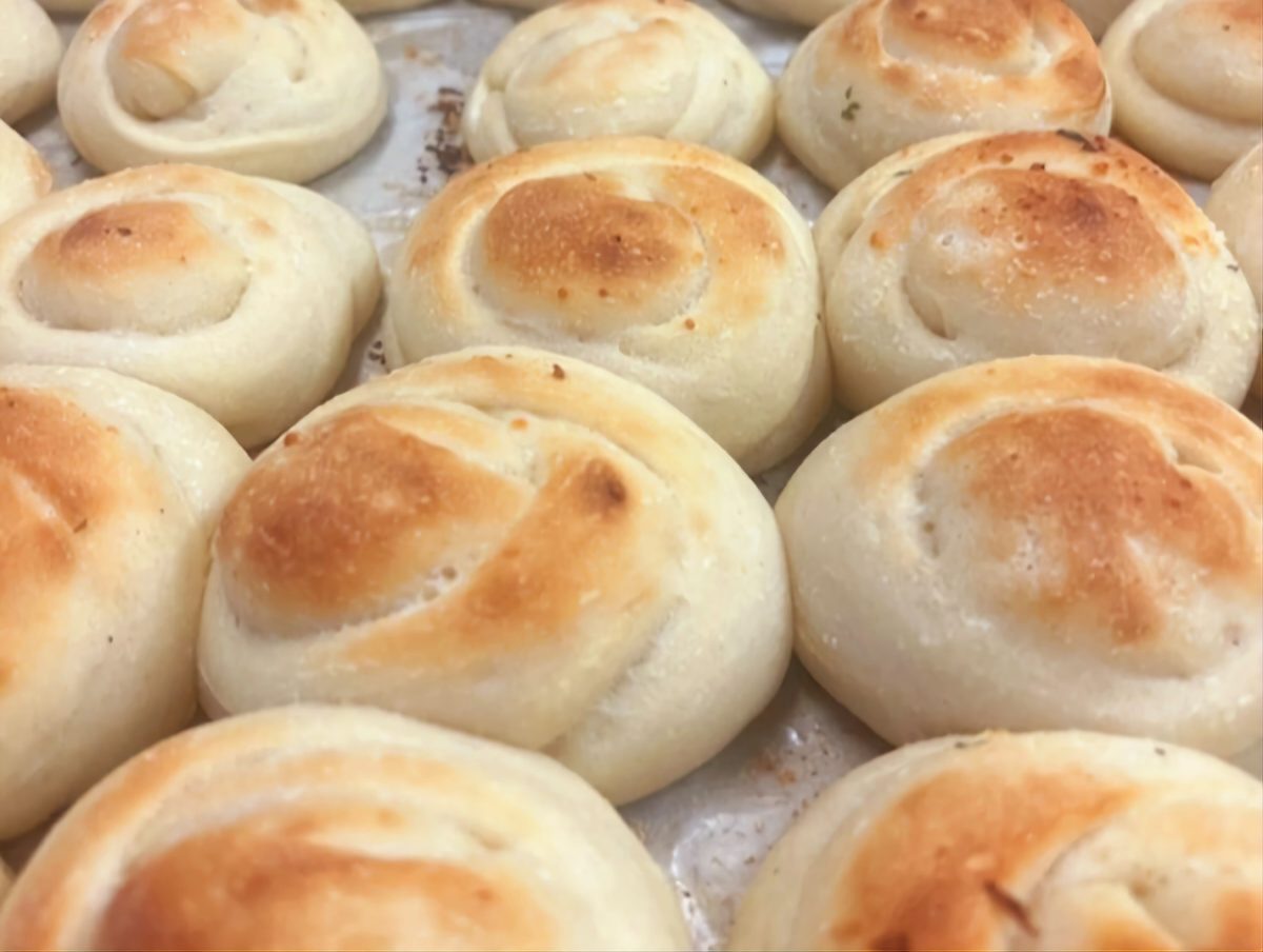 A tray of fresh golden garlic knots
