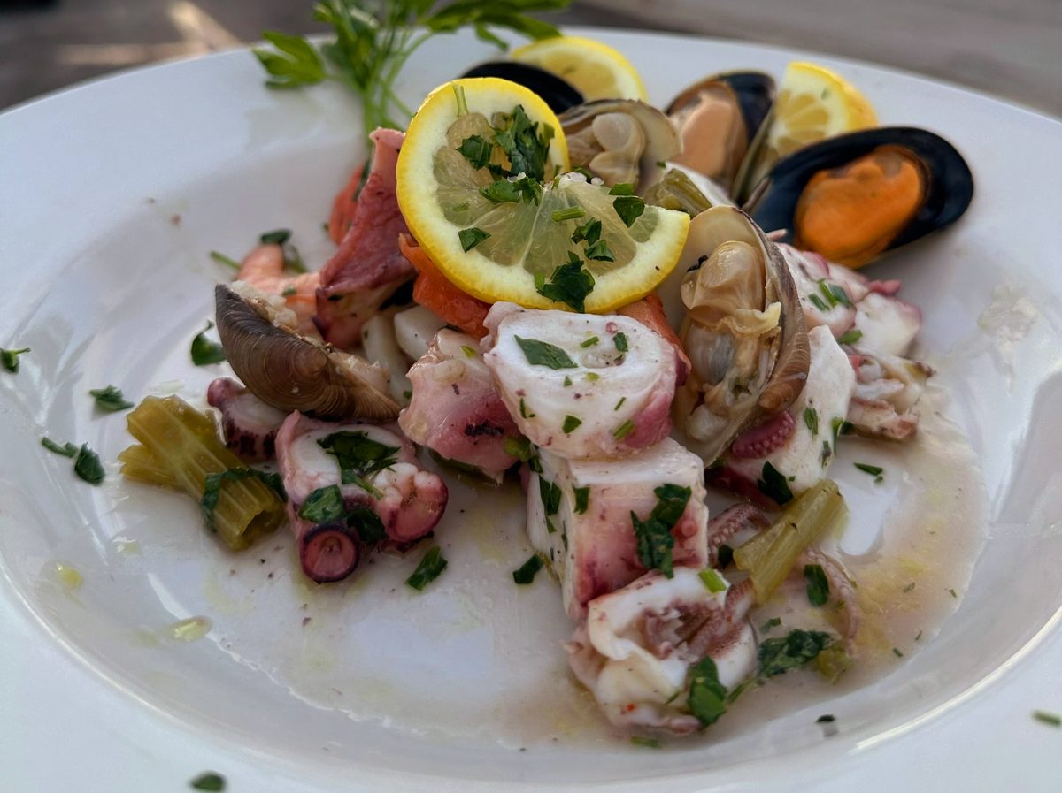 Cold seafood salad with octopus, mussels, clams, calamari and lemon